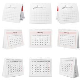 Image of Set of different paper calendars on white background