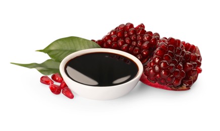 Bowl of pomegranate sauce and fresh ripe fruit on white background