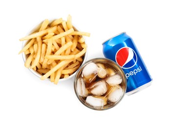 Photo of MYKOLAIV, UKRAINE - FEBRUARY 15, 2021: Glass of Pepsi, can and snack on white background, top view