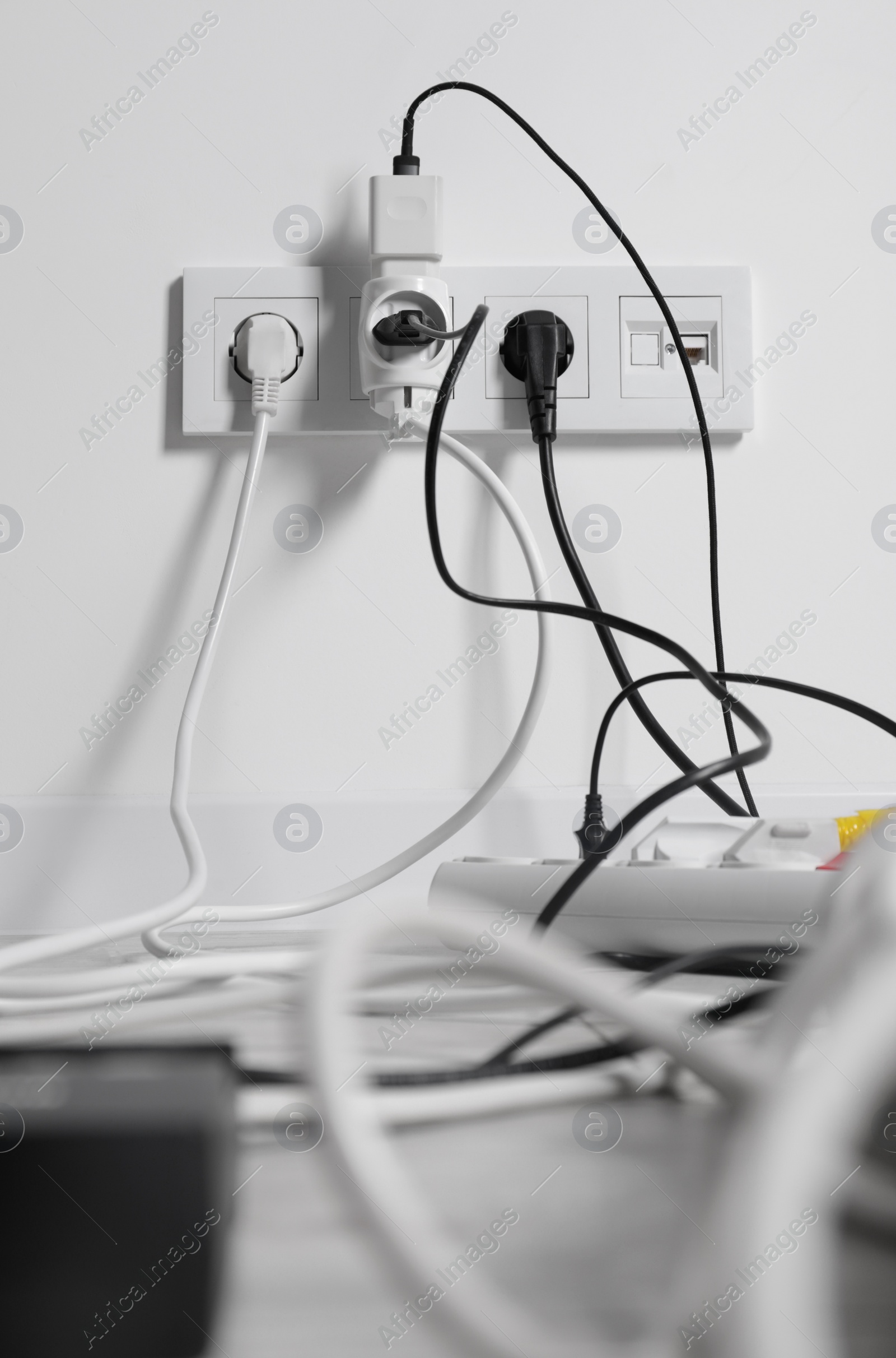 Photo of Many different electrical power plugs in sockets indoors