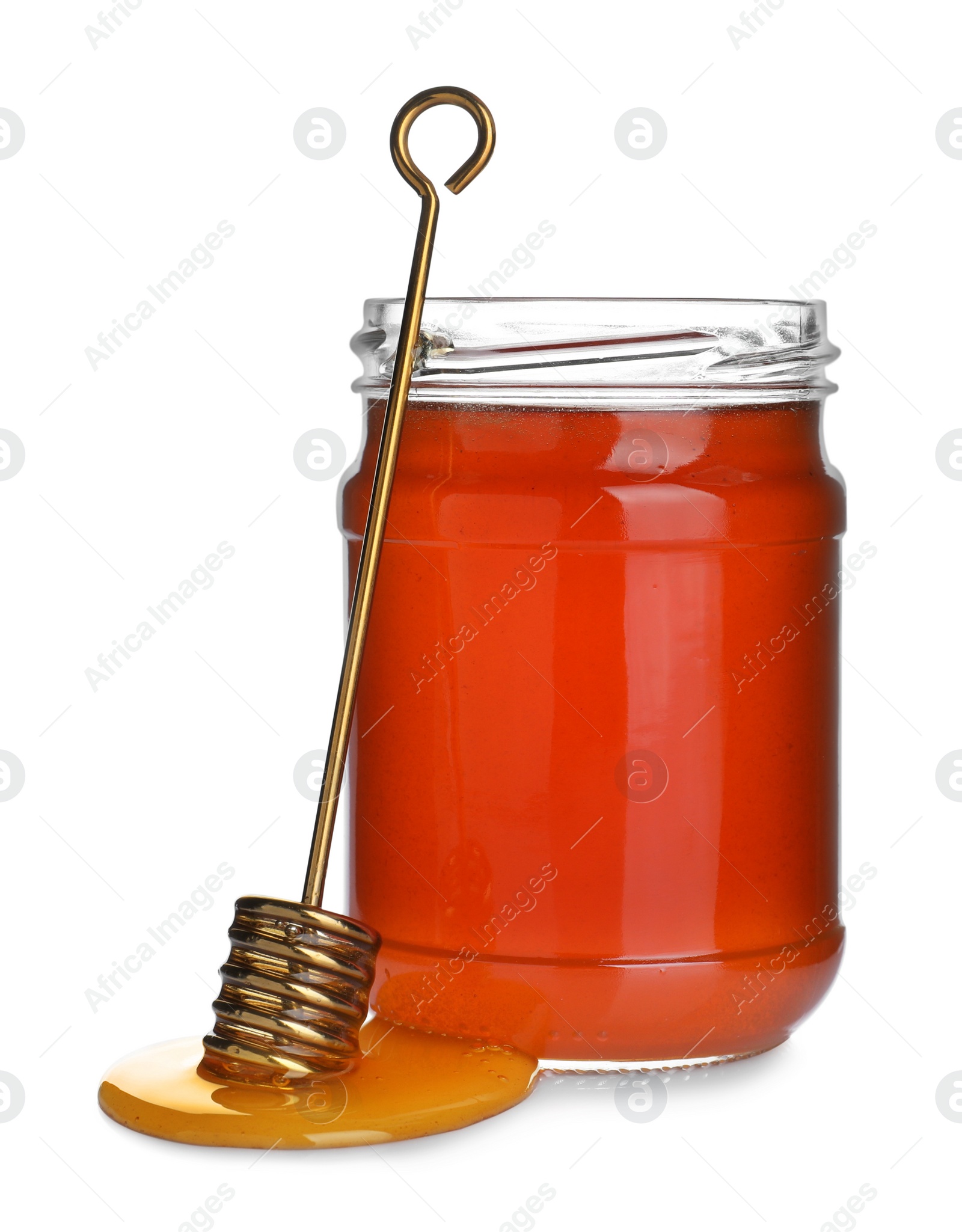 Photo of Jar of organic honey and dipper isolated on white