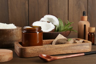 Photo of Homemade cosmetic products and fresh ingredients on wooden table