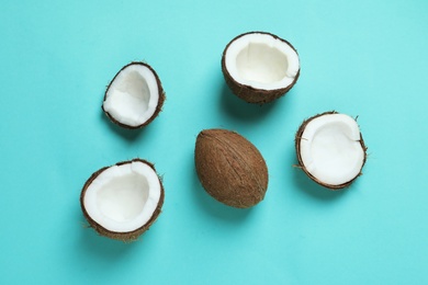 Photo of Ripe coconuts on color background