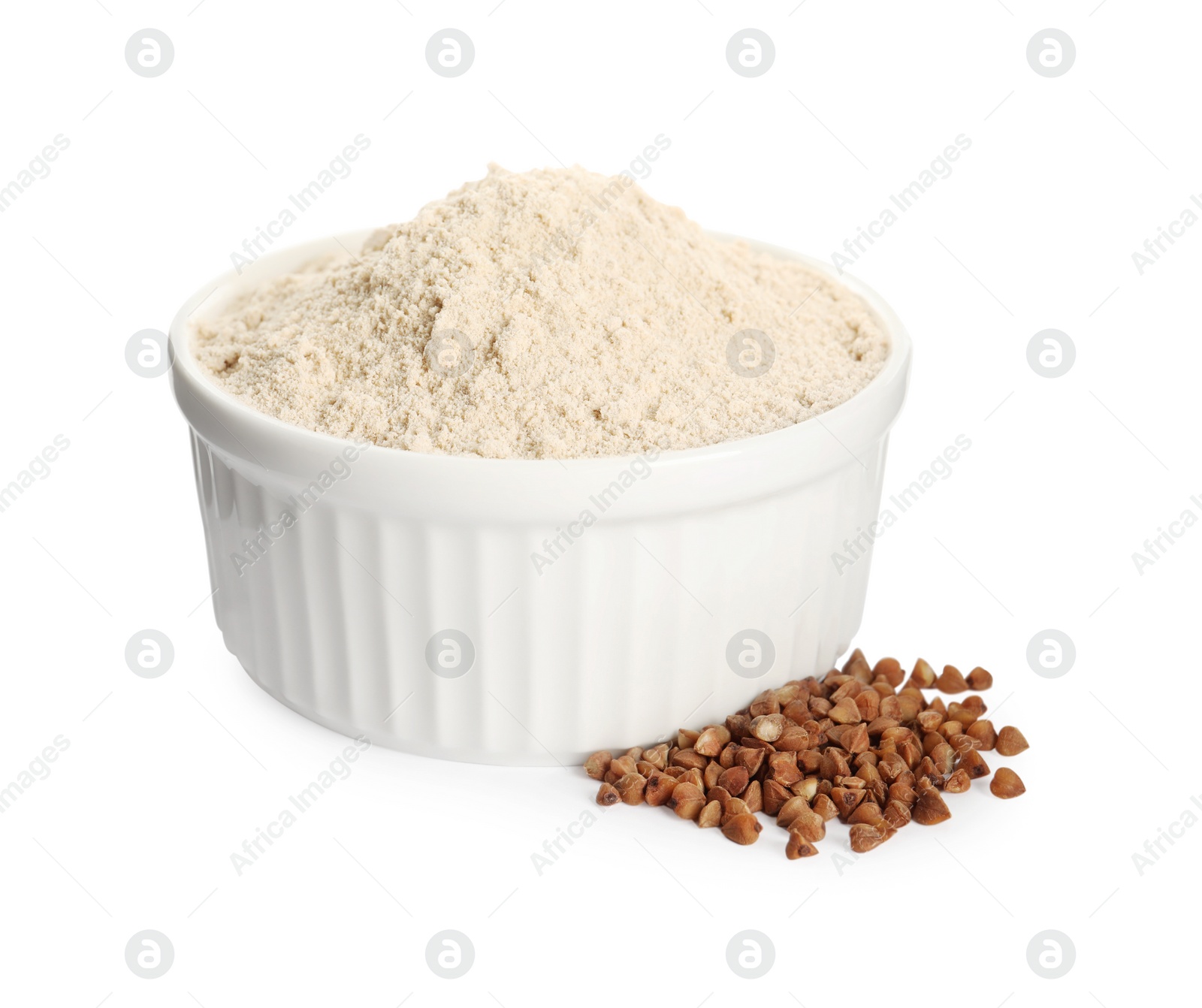 Photo of Bowl of buckwheat flour on white background