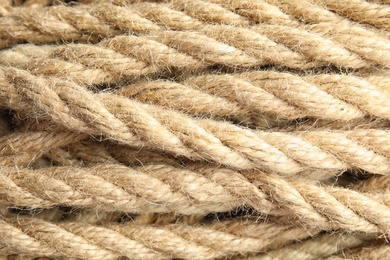 Photo of Natural hemp ropes as background, closeup view