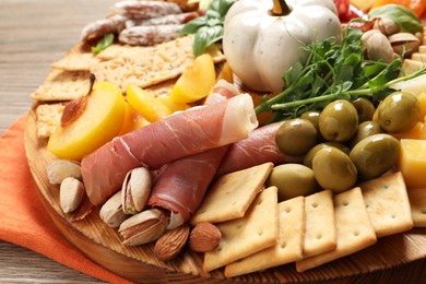 Photo of Different tasty appetizers on wooden table, closeup