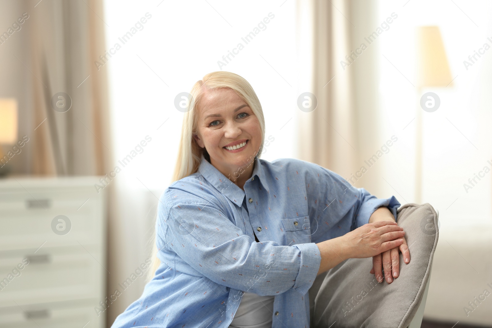 Photo of Portrait of happy mature woman at home