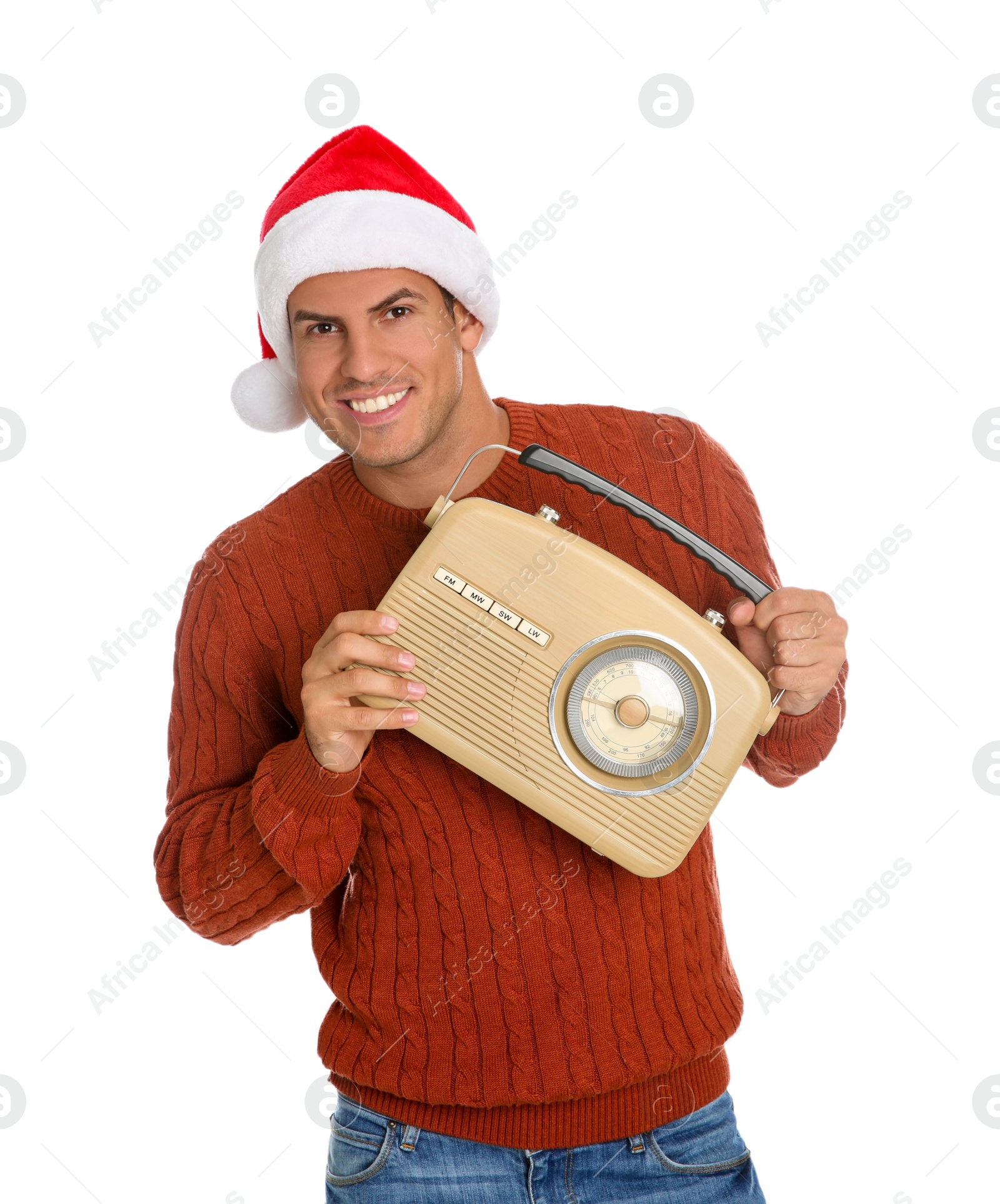 Photo of Happy man with vintage radio on white background. Christmas music