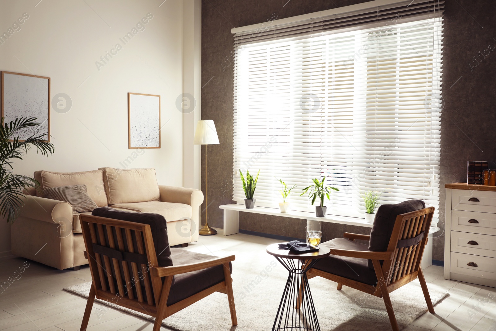 Photo of Living room interior with comfortable sofa and armchairs