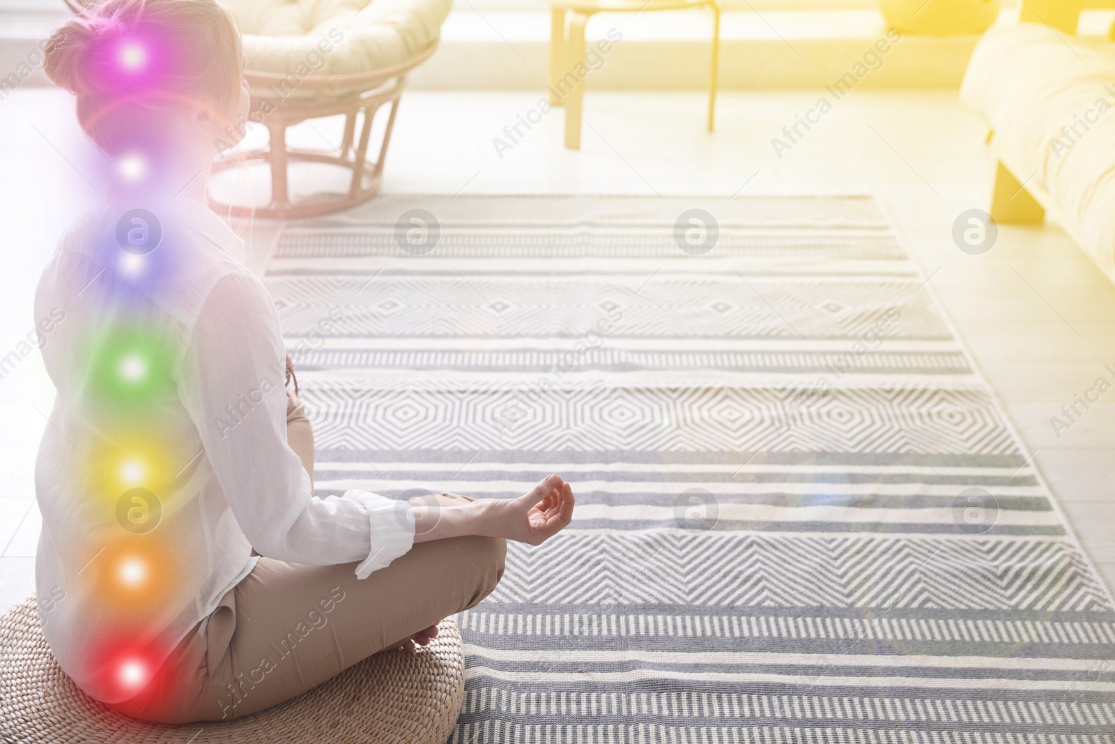 Image of Woman meditating on wicker mat at home. Scheme of seven chakras, illustration