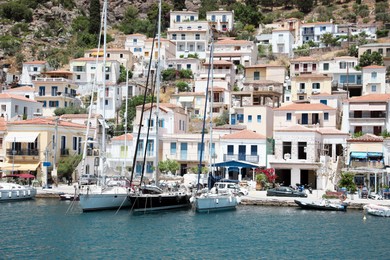 Photo of Beautiful view of coastal city with boats on sunny day