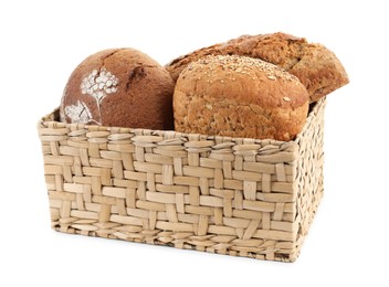 Photo of Basket with different types of fresh bread isolated on white