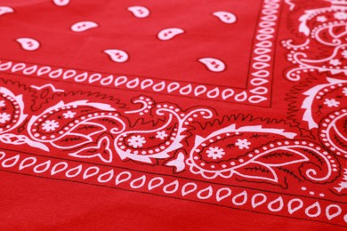 Closeup view of red bandana with paisley pattern as background