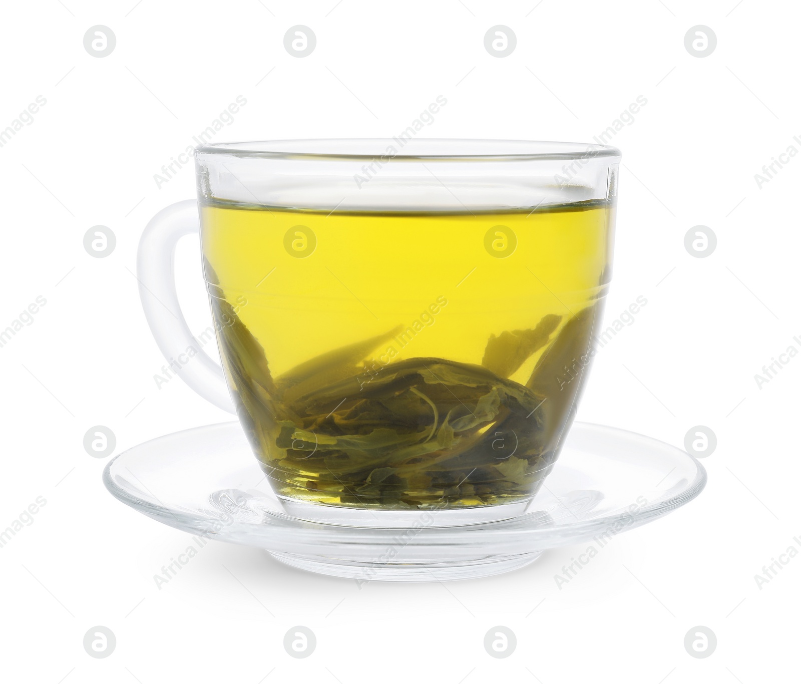 Photo of Fresh green tea in glass cup, leaves and saucer isolated on white