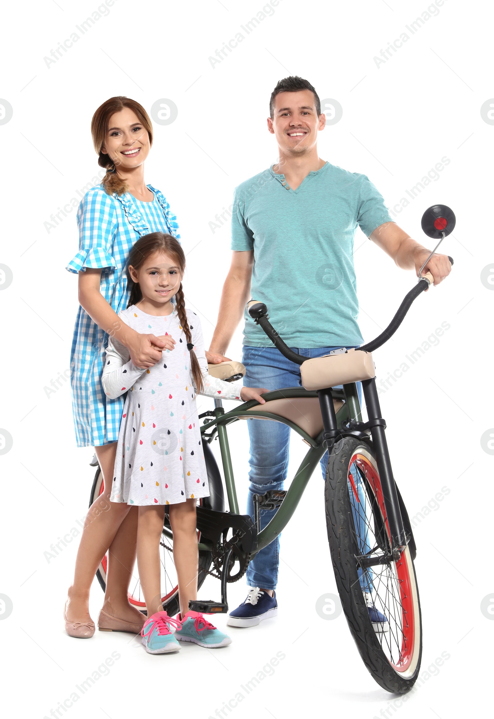 Photo of Portrait of parents and their daughter with bicycle on white background