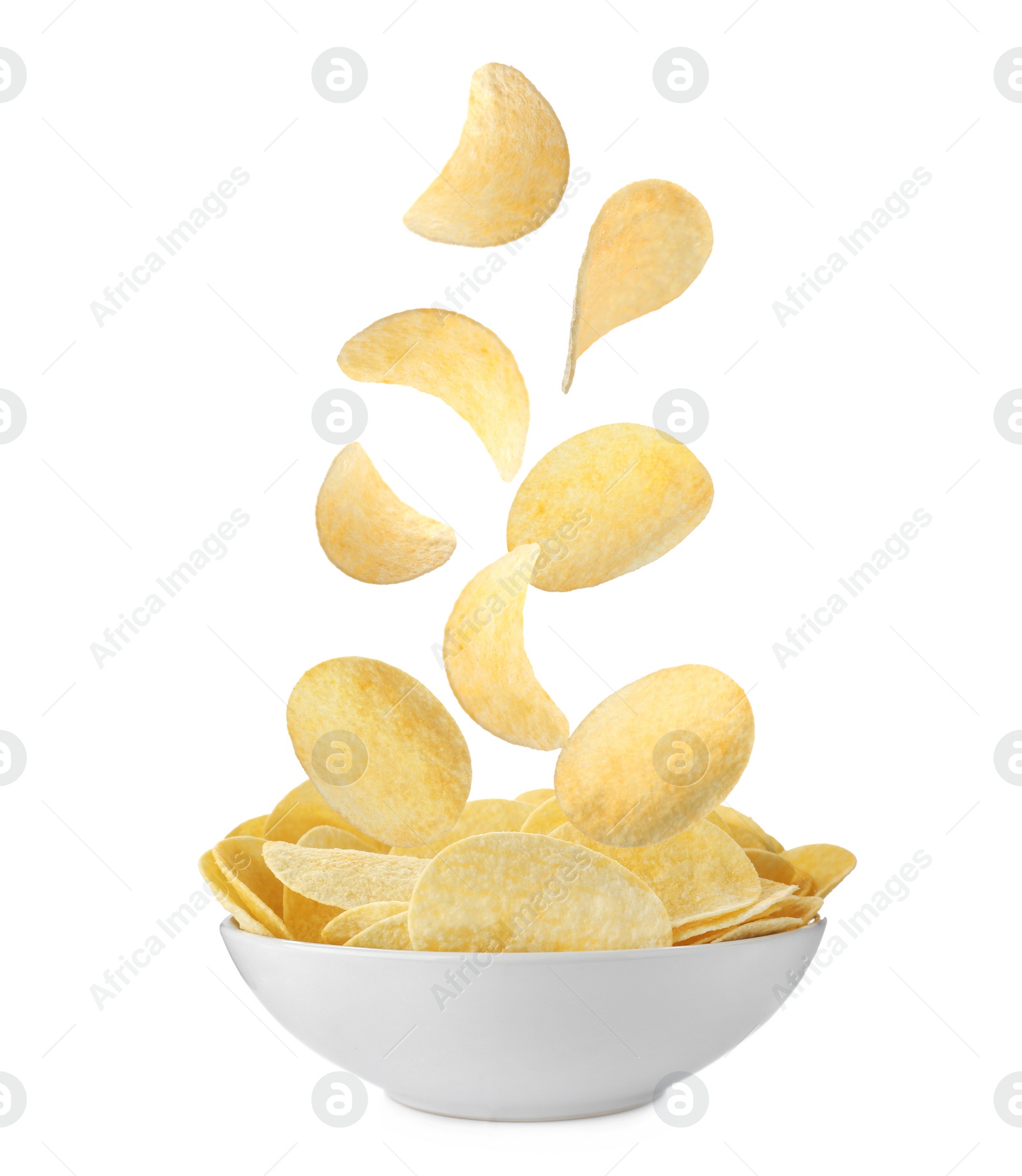 Image of Fried crispy potato chips falling into bowl on white background