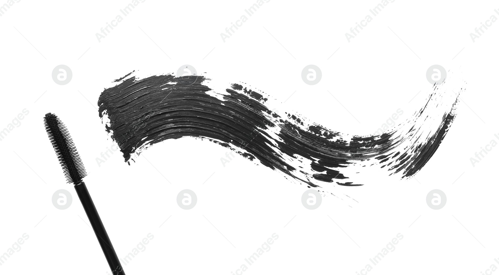 Photo of Smear of mascara and applicator isolated on white, top view