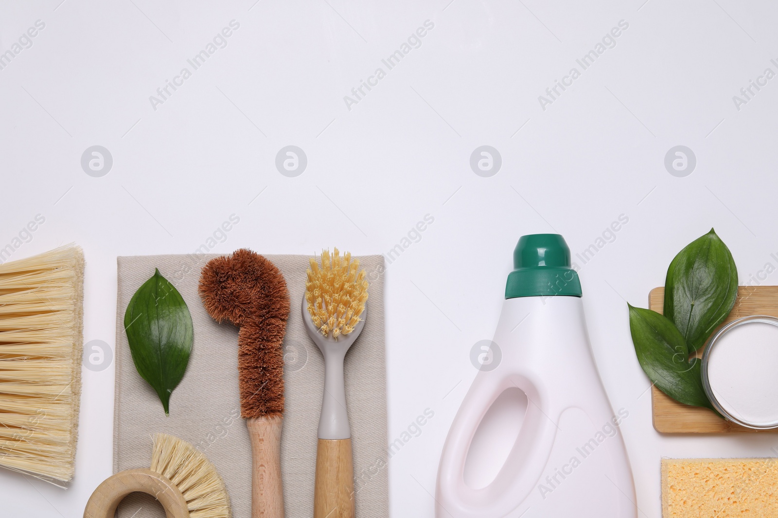 Photo of Flat lay composition with different cleaning supplies on white background