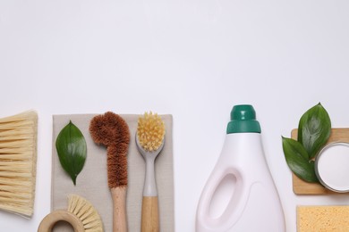 Photo of Flat lay composition with different cleaning supplies on white background