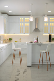 Photo of Modern kitchen with stylish furniture. Interior design