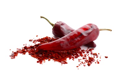 Photo of Composition with chili pepper flakes on white background