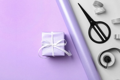 Photo of Flat lay composition with beautiful gift box and space for text on color background