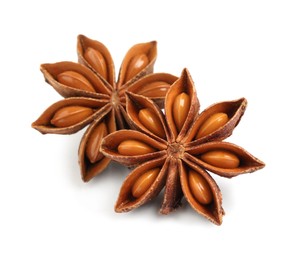 Photo of Dry anise stars with seeds on white background