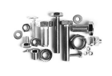 Photo of Different metal bolts and nuts on white background, top view