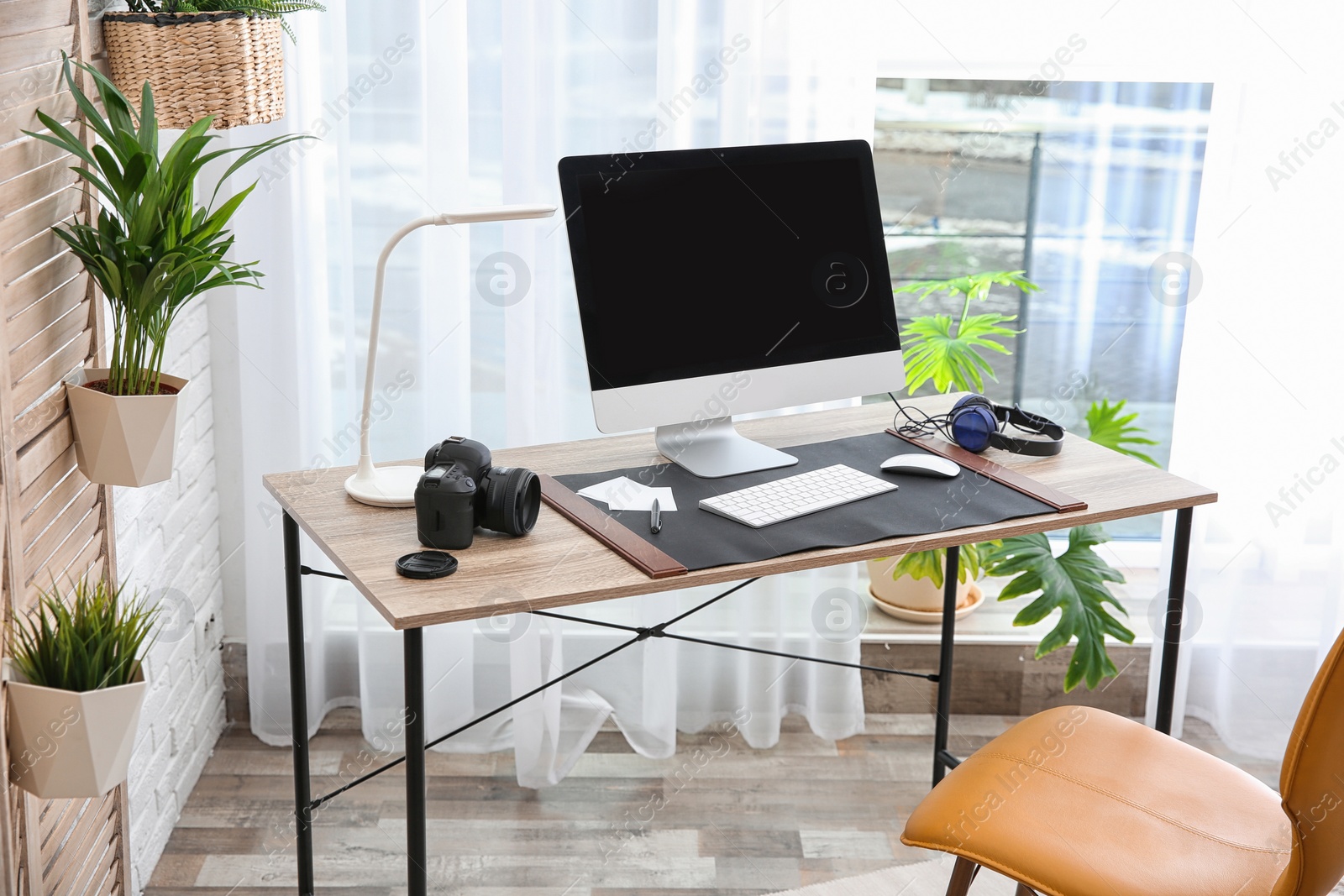 Photo of Light modern interior of working place with computer