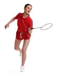 Young woman playing badminton with racket on white background