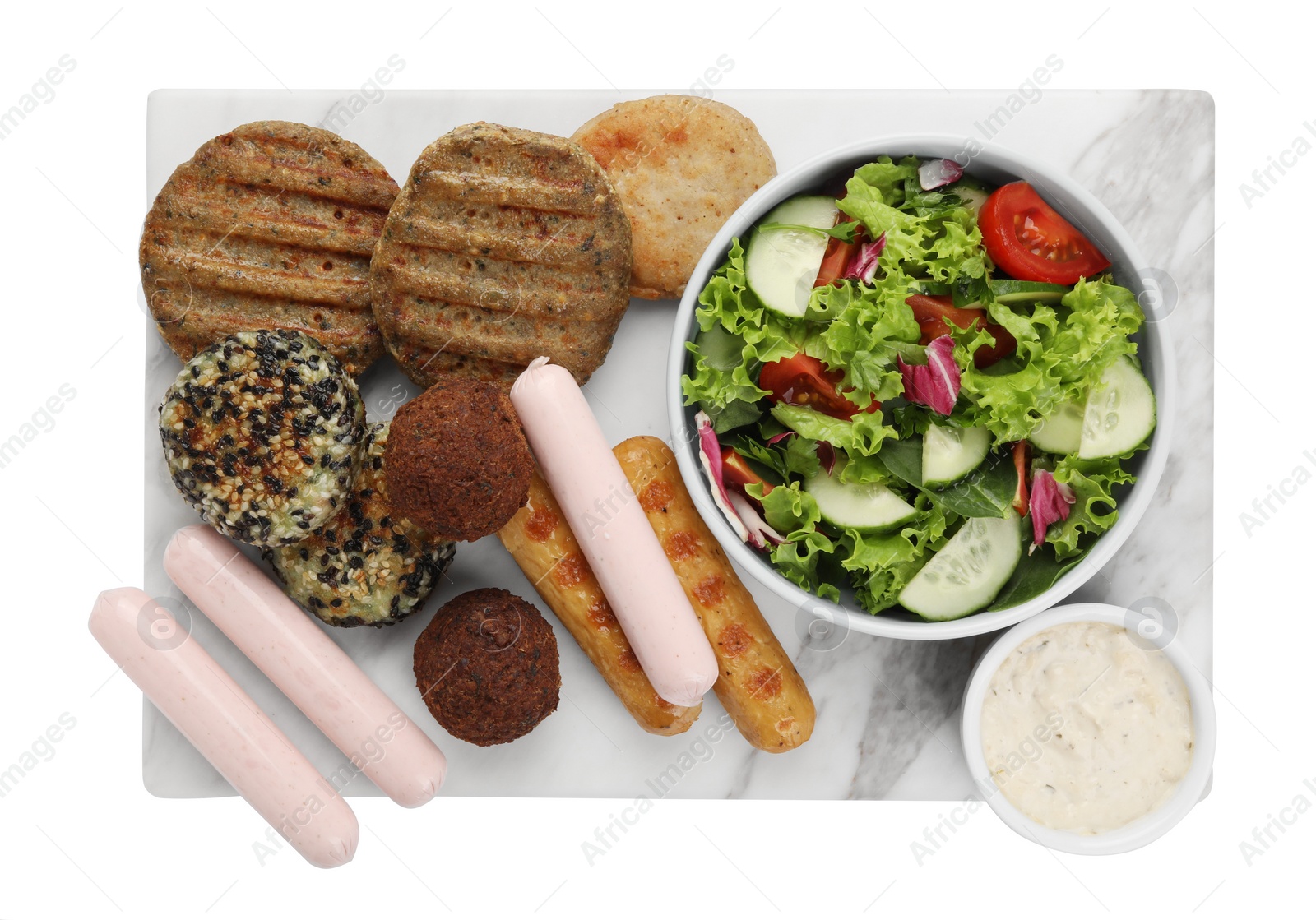 Photo of Serving board with different tasty vegan meat products, sauce and fresh vegetable salad isolated on white, top view