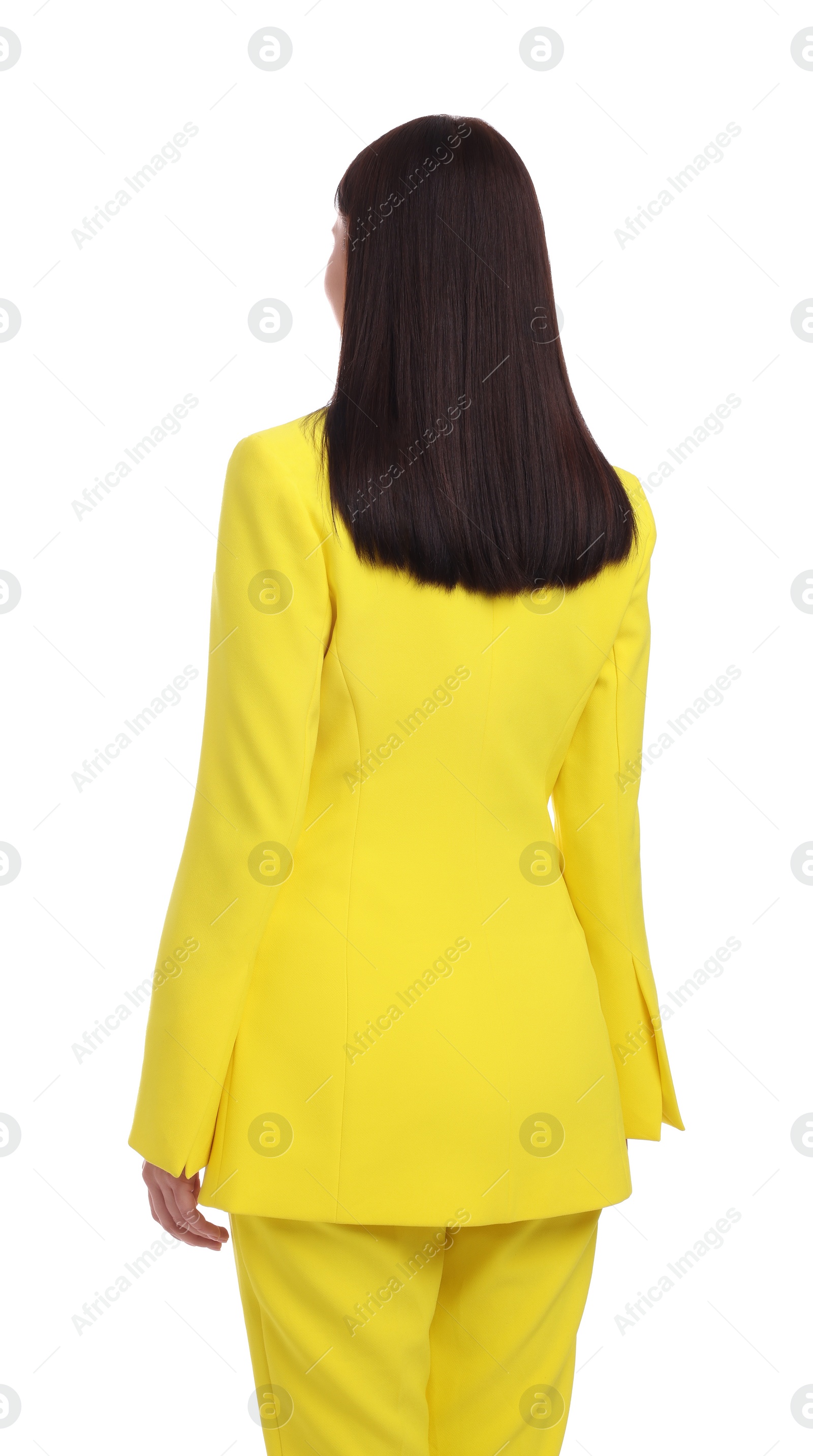 Photo of Businesswoman in yellow suit standing on white background