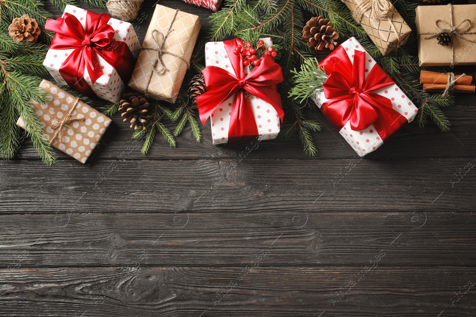 Photo of Flat lay composition with Christmas gifts on wooden background