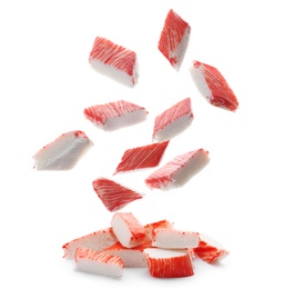 Image of Cut fresh crab sticks falling on white background