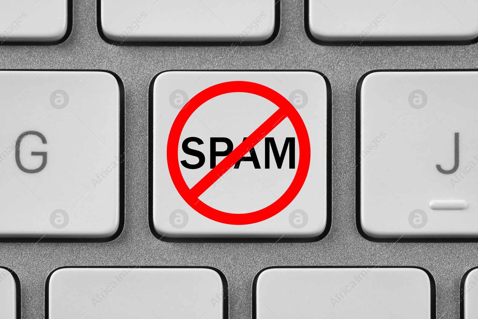 Image of Prohibition sign with word Spam on laptop button, top view. Device keyboard, closeup