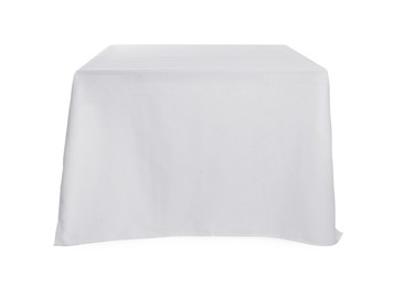 Photo of Table with white tablecloth isolated on white