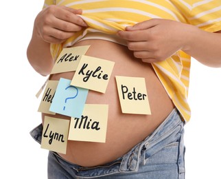 Photo of Pregnant woman with different baby names on belly against white background, closeup