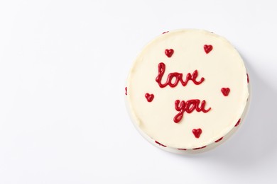 Photo of Bento cake with text Love You and space for text on white table, top view. St. Valentine's day surprise