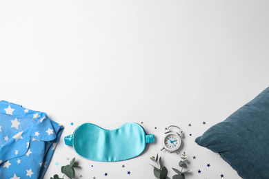Photo of Composition with sleeping mask on white background, top view. Bedtime accessories