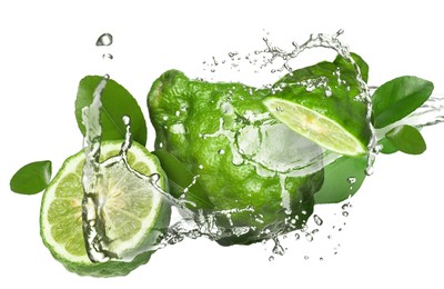 Image of Fresh ripe bergamot fruits, green leaves and splashing water on white background