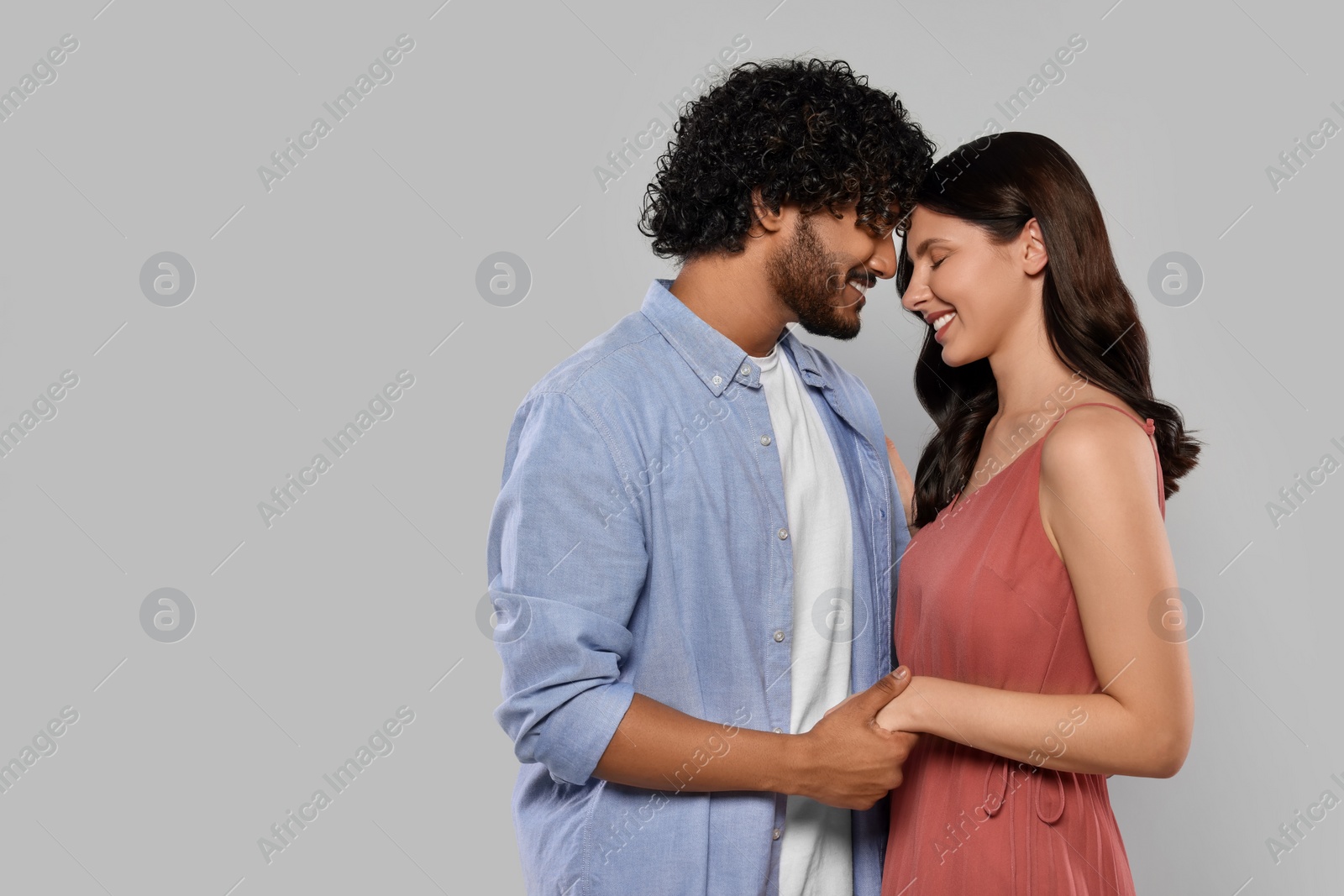 Photo of International dating. Portrait of happy couple on light grey background, space for text