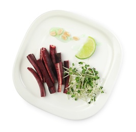 Photo of Delicious fresh carrot salad isolated on white, top view