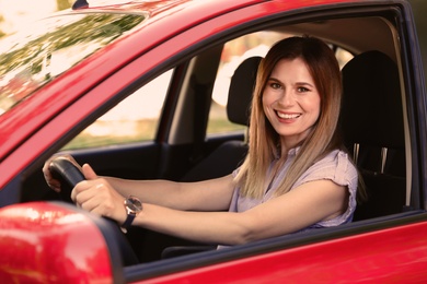 Photo of Happy beautiful woman driving modern car