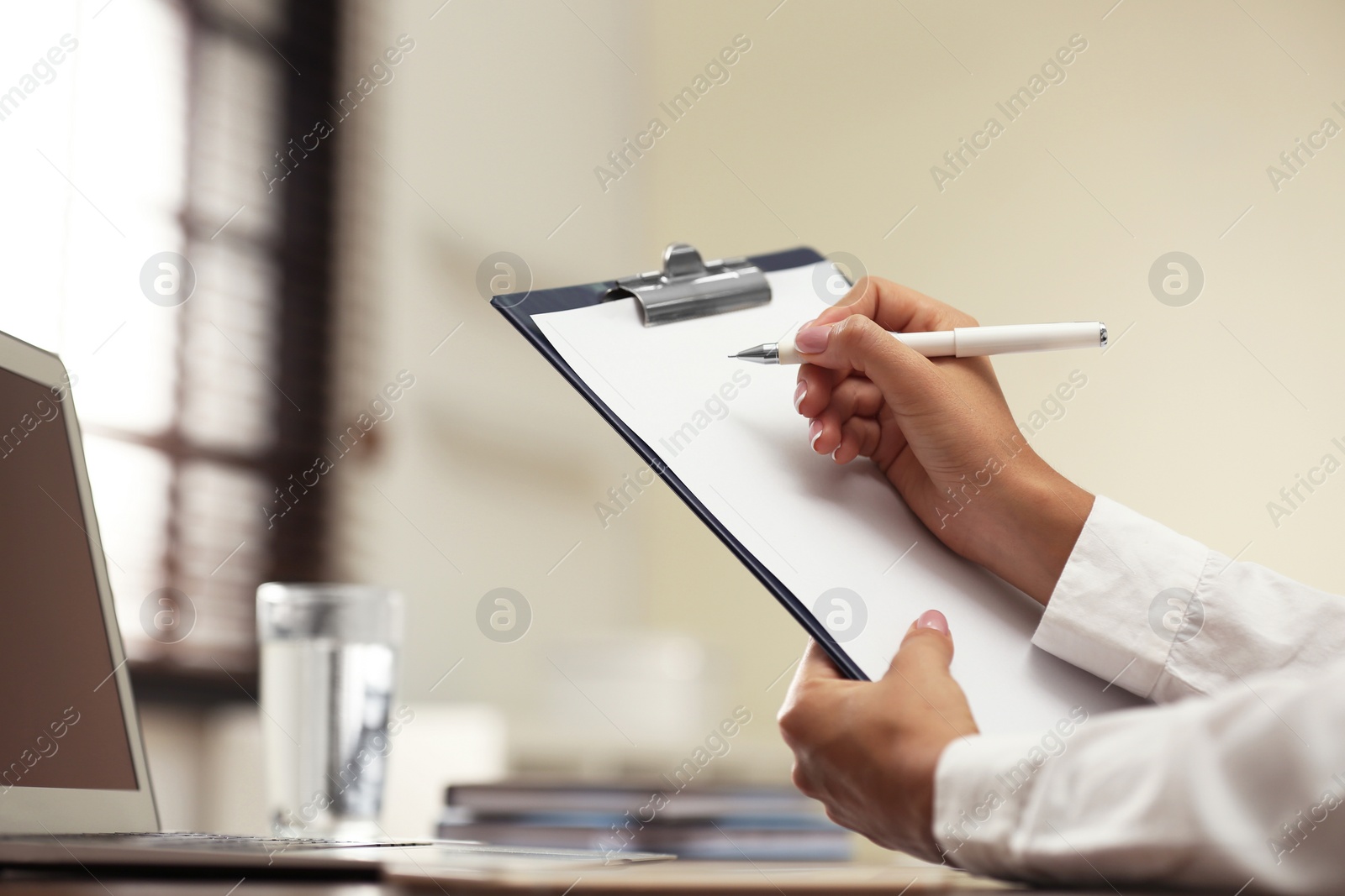 Photo of Business trainer working at table in office, closeup