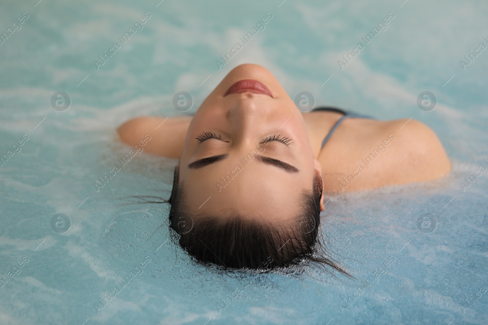 Photo of Beautiful woman relaxing in spa swimming pool