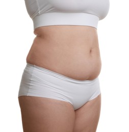 Woman with excessive belly fat on white background, closeup. Overweight problem