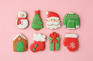 Photo of Different Christmas gingerbread cookies on pink background, flat lay