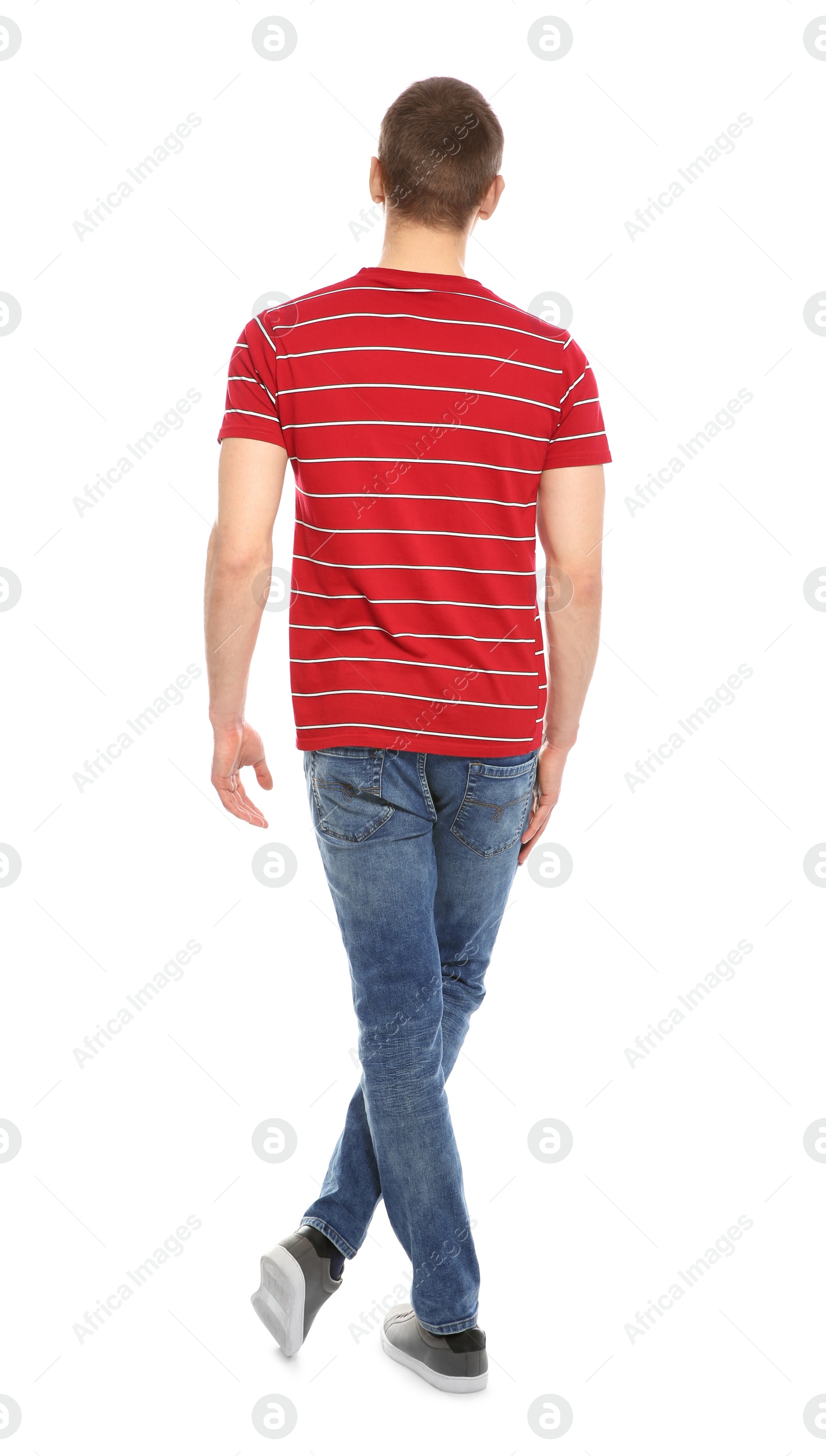 Photo of Young man in stylish clothes on white background, back view