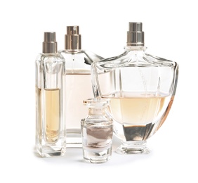 Photo of Different perfume bottles on white background