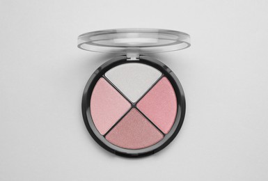 Colorful contouring palette on light grey background, top view. Professional cosmetic product